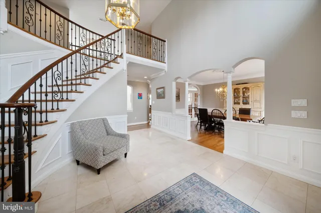 a view of a dining room with furniture wooden floor and chandelier