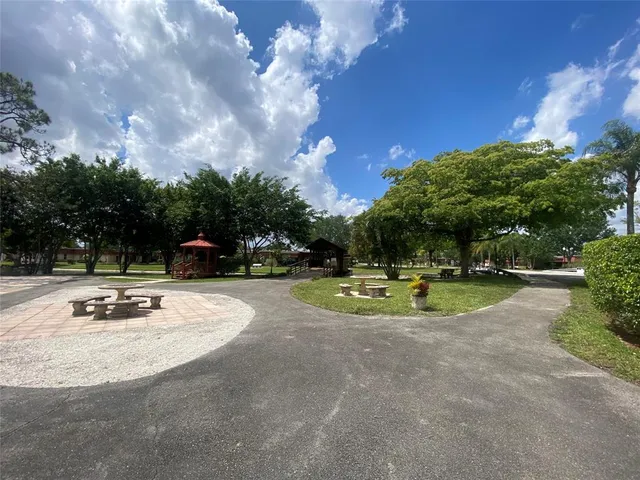 a view of a swimming pool with a yard