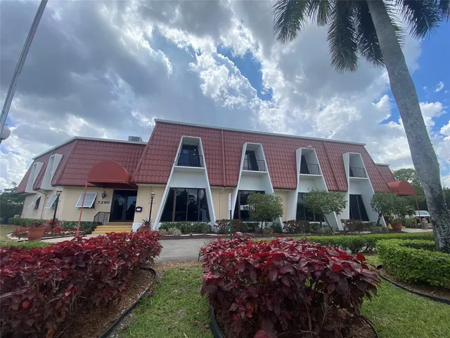 a front view of house with yard and outdoor seating