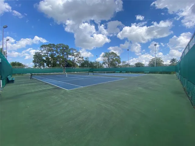 a view of a golf course with green space