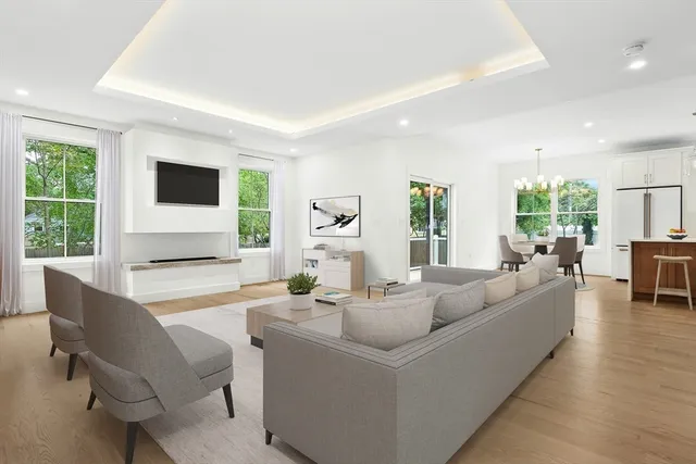 a living room with fireplace furniture and a flat screen tv