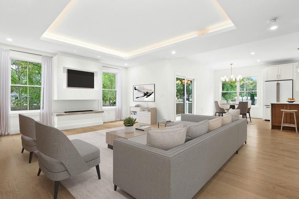 a living room with fireplace furniture and a flat screen tv