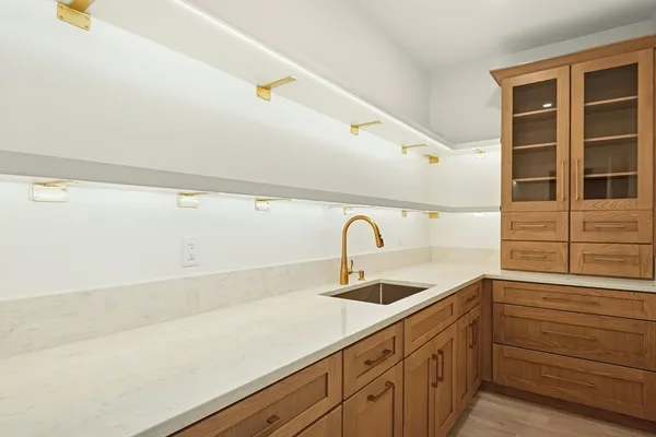 a kitchen with a sink and cabinets