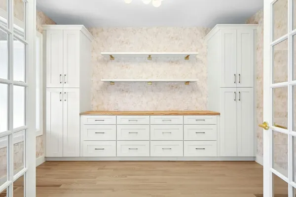 a view of wooden closet with wooden floor