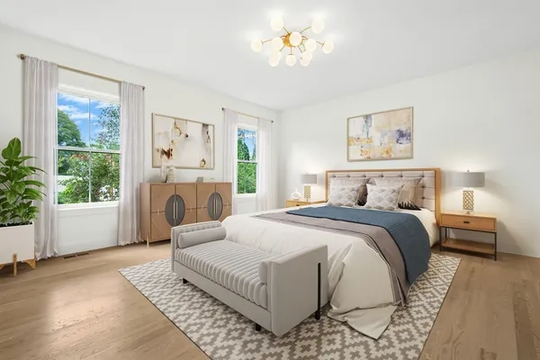 a bedroom with a large bed and a window