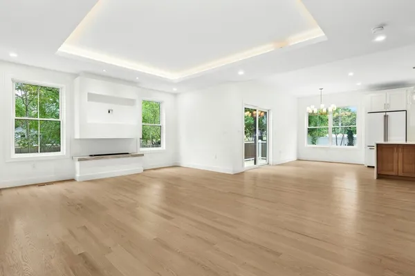 an empty room with windows and entrance