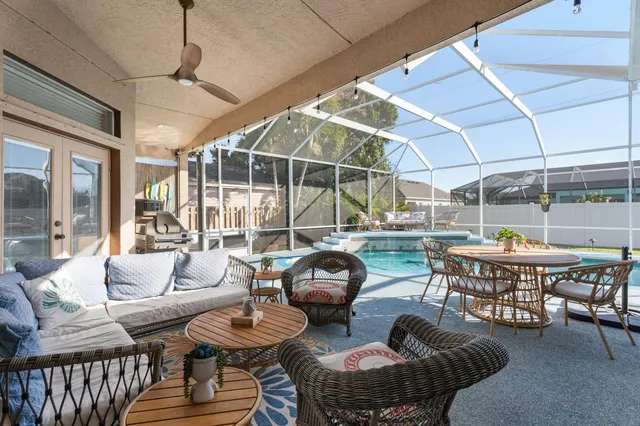 a living room with furniture a table and chairs