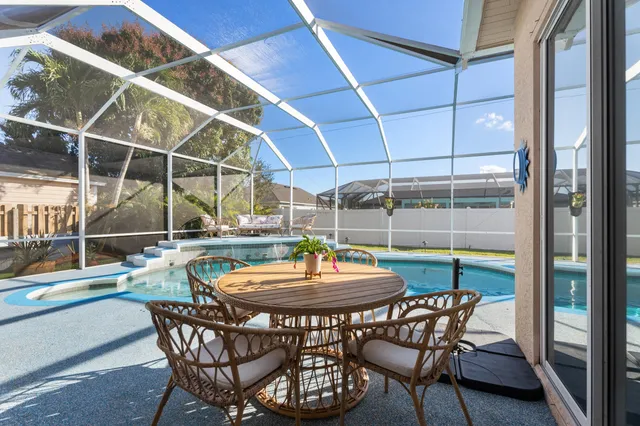 a view of a outdoor space with table and chairs