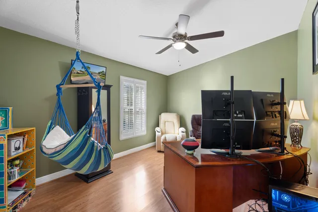 a workspace with furniture and wooden floor
