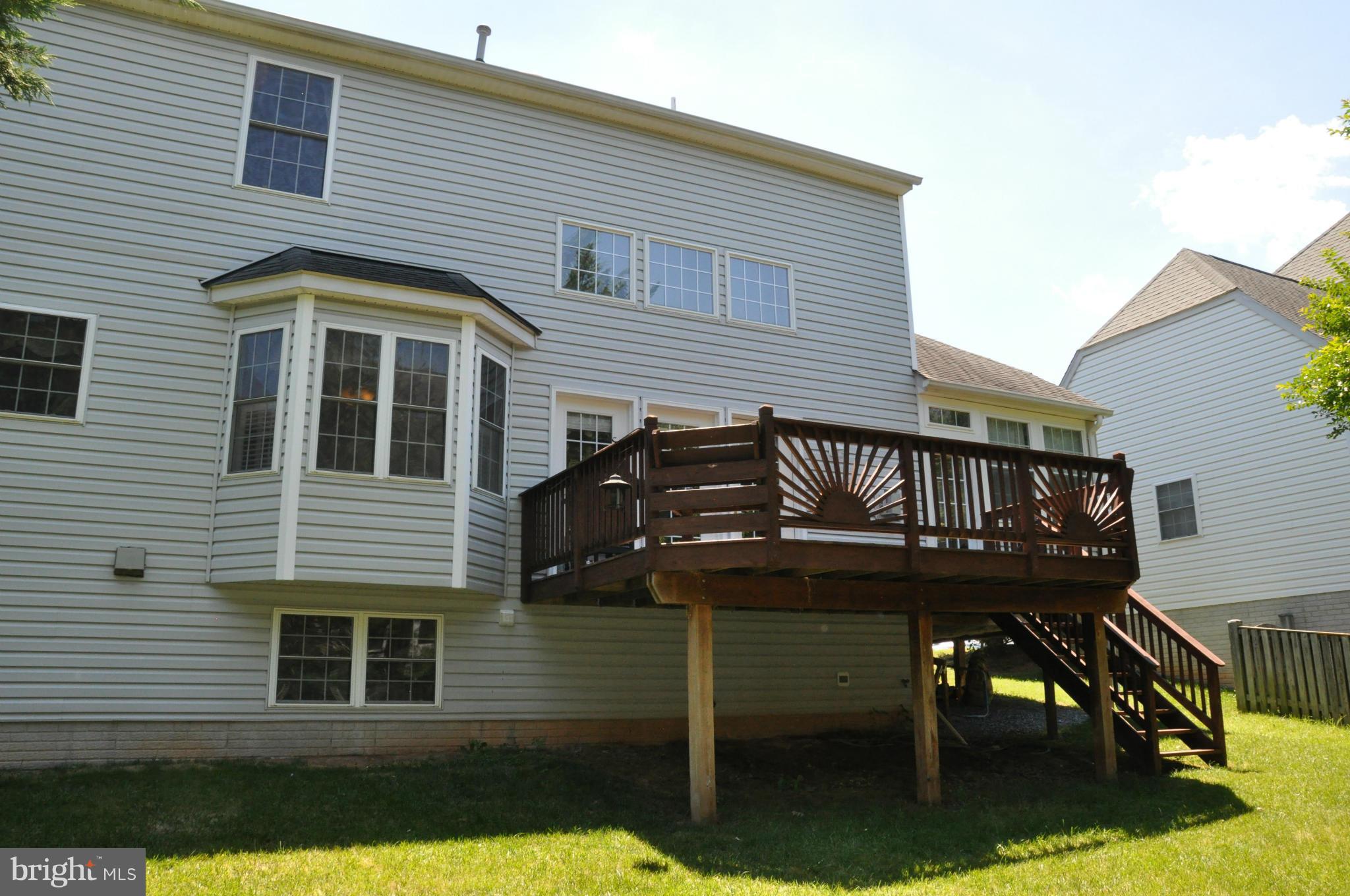 2585 Bear Den Road Frederick, MD 21701 - Photo 2 of 30 a view of a house with wooden deck