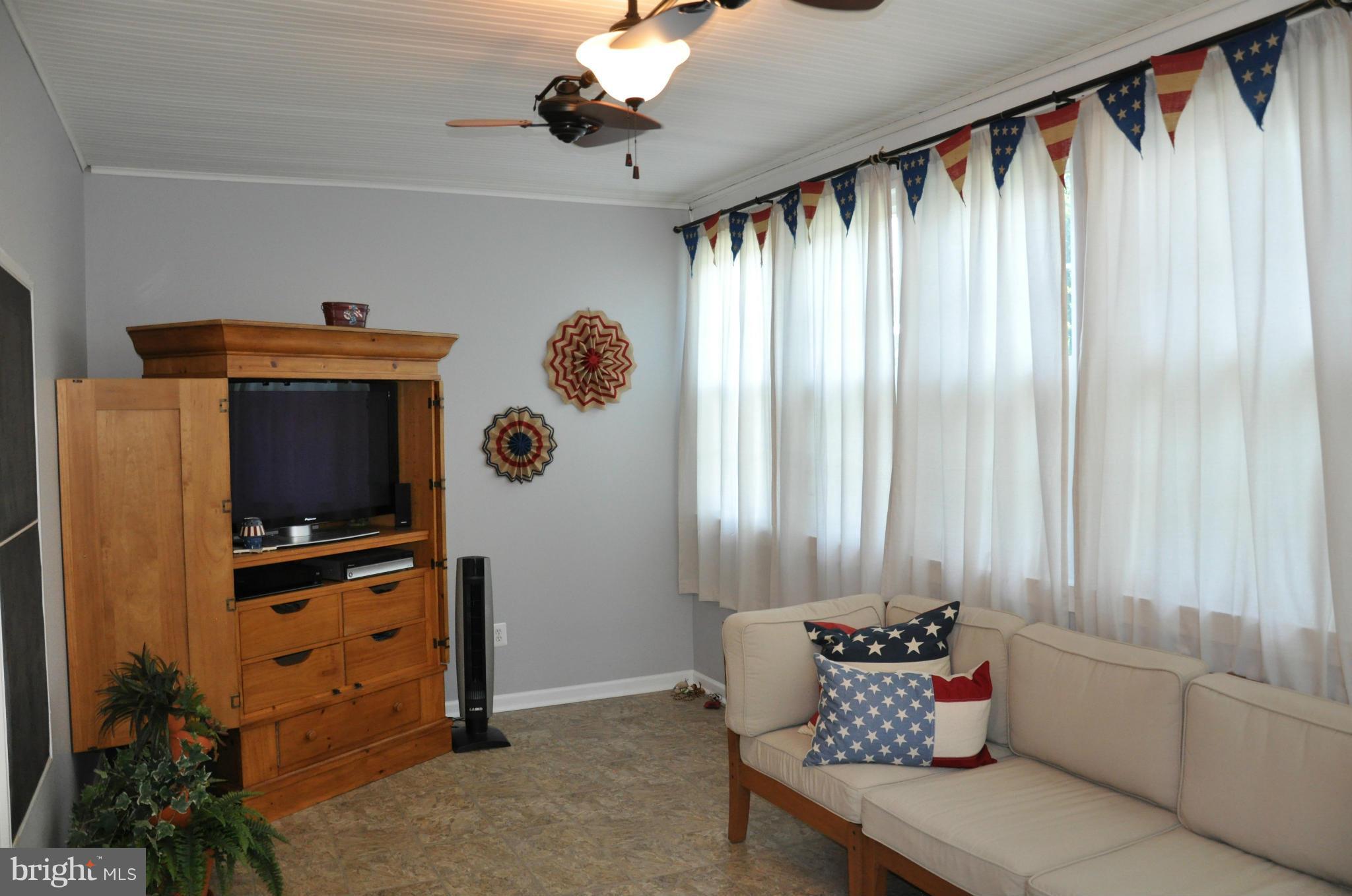 2585 Bear Den Road Frederick, MD 21701 - Photo 18 of 30 a living room with furniture and a window