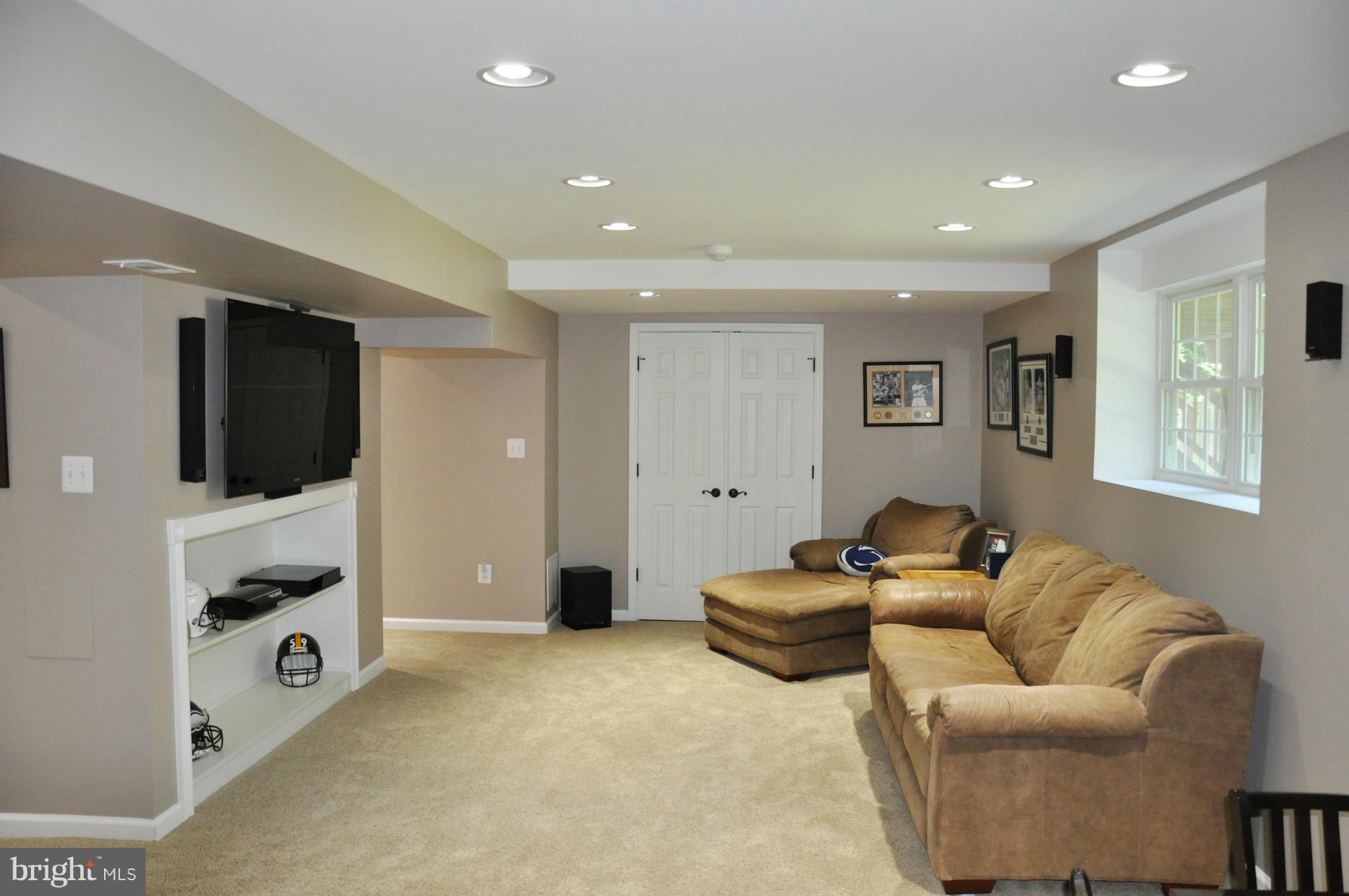 2585 Bear Den Road Frederick, MD 21701 - Photo 20 of 30 a living room with furniture and a flat screen tv