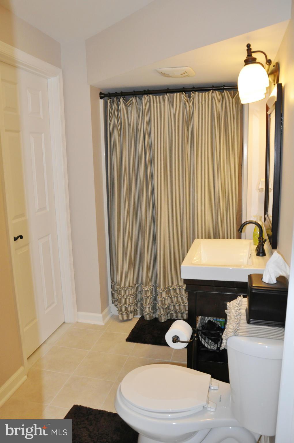 2585 Bear Den Road Frederick, MD 21701 - Photo 22 of 30 a bathroom with a sink toilet and shower