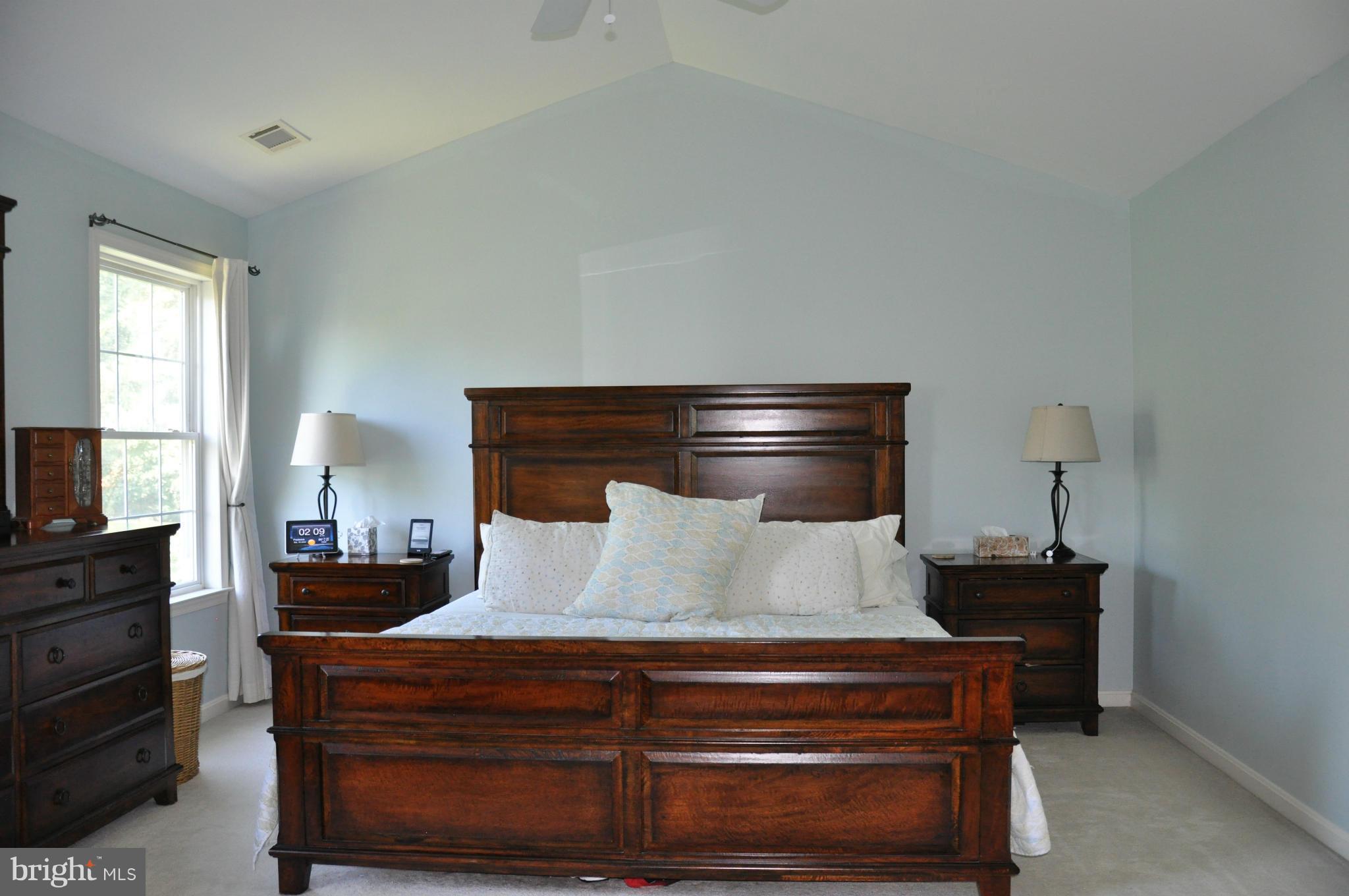 2585 Bear Den Road Frederick, MD 21701 - Photo 25 of 30 a bedroom with a bed and wooden floor