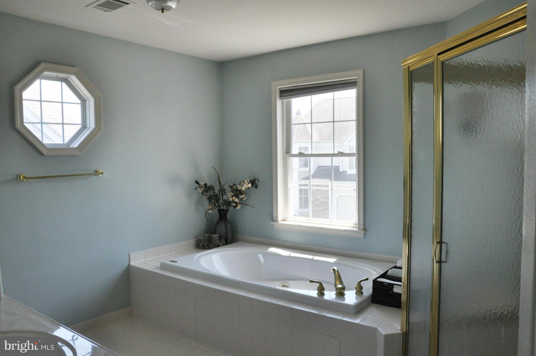 2585 Bear Den Road Frederick, MD 21701 - Photo 26 of 30 a white bath tub sitting next to a window
