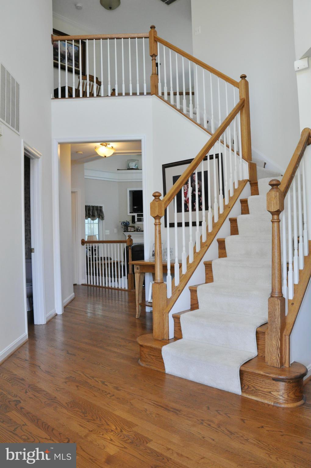 2585 Bear Den Road Frederick, MD 21701 - Photo 5 of 30 a view of staircase with lots of frames on wall and a window