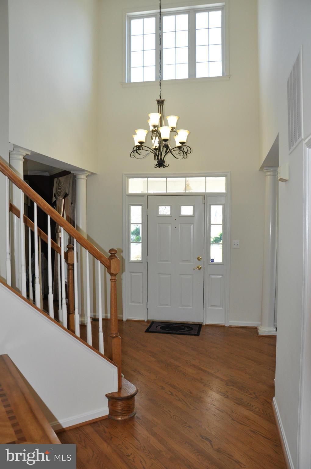 2585 Bear Den Road Frederick, MD 21701 - Photo 6 of 30 a view of a hallway with wooden floor and staircase