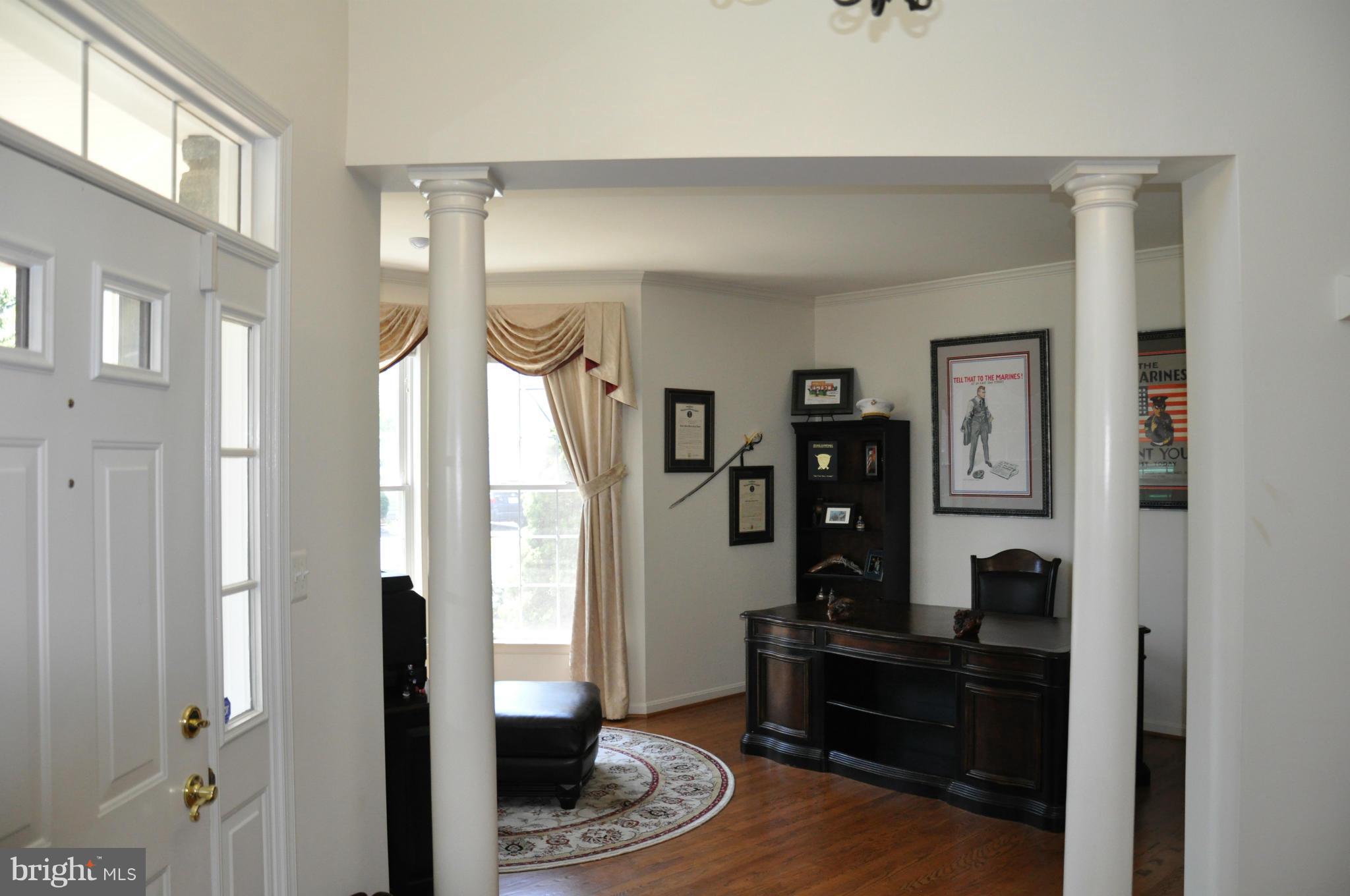 2585 Bear Den Road Frederick, MD 21701 - Photo 7 of 30 a living room with furniture and a wooden floor