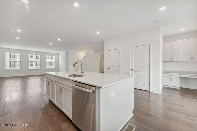 a kitchen with a sink and cabinets