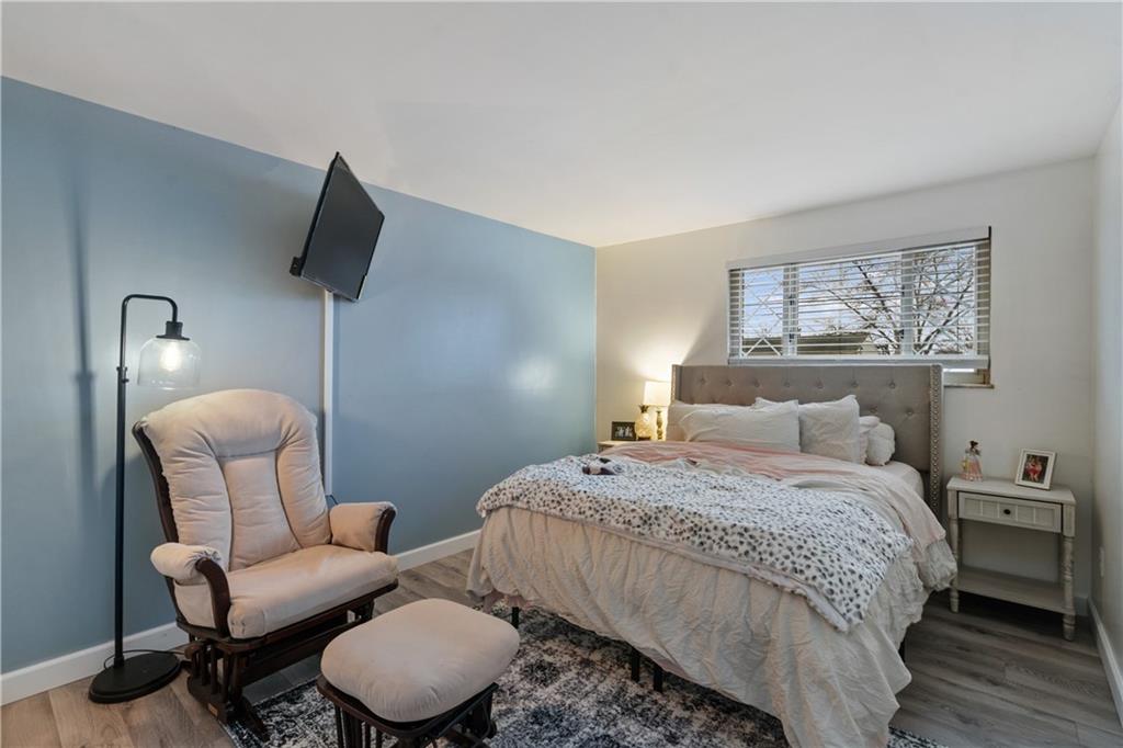 139 William Circle McKees Rocks, PA 15136 - Photo 12 of 24 a bedroom with a bed and a chair