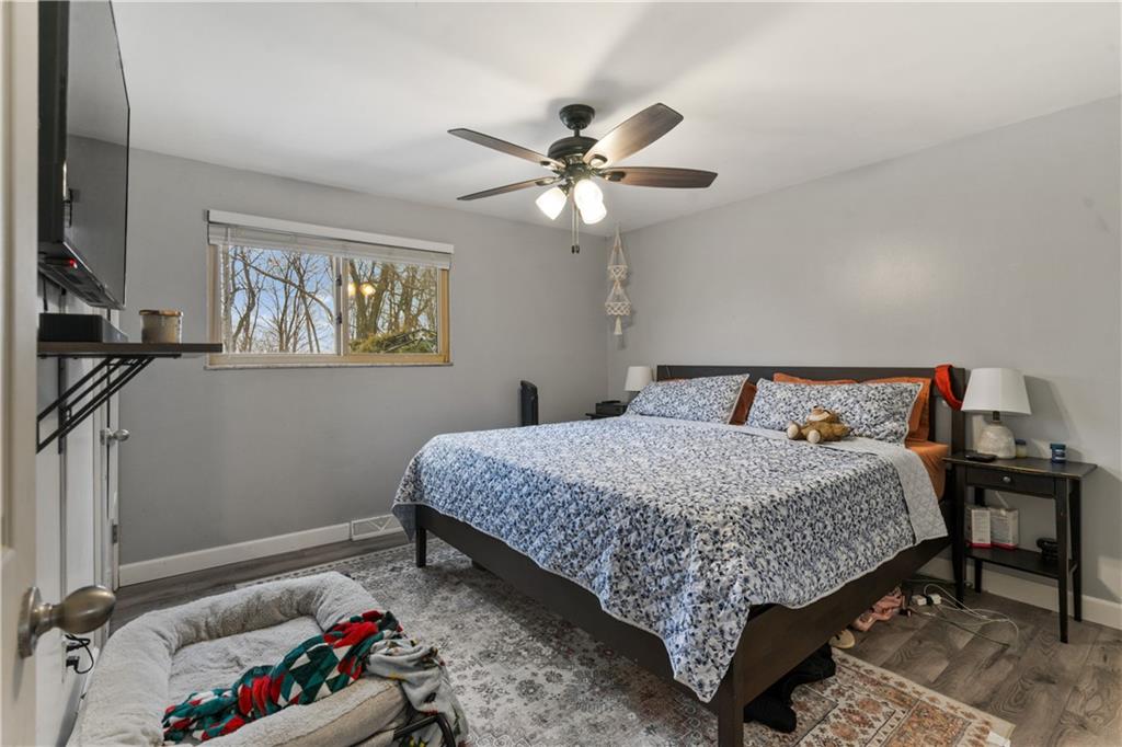 139 William Circle McKees Rocks, PA 15136 - Photo 14 of 24 a bedroom with bed and a chandelier