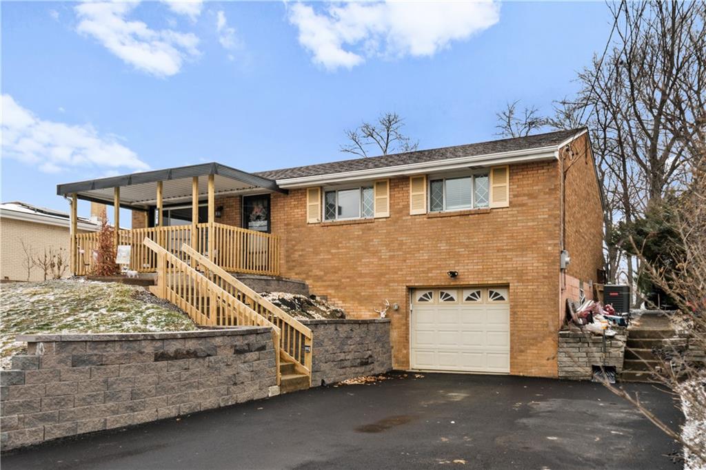 139 William Circle McKees Rocks, PA 15136 - Photo 2 of 24 a view of a house with a garage