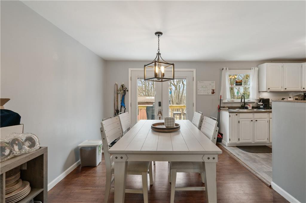 139 William Circle McKees Rocks, PA 15136 - Photo 7 of 24 a kitchen with kitchen island a stove a table and chairs in it