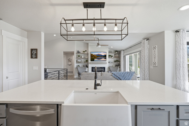 638 Canyon Rim Road Smithfield, UT 84335 - Photo 56 of 56 Kitchen with a ceiling fan, dishwasher, a fireplace, lofted ceiling, and open floor plan