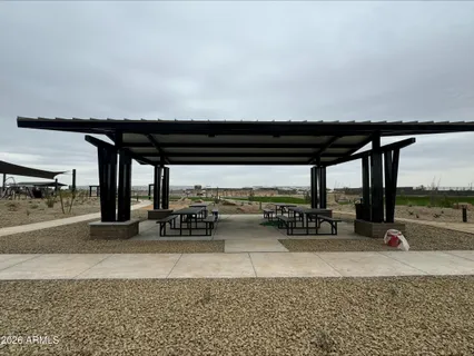 a view of a swimming pool with an outdoor seating