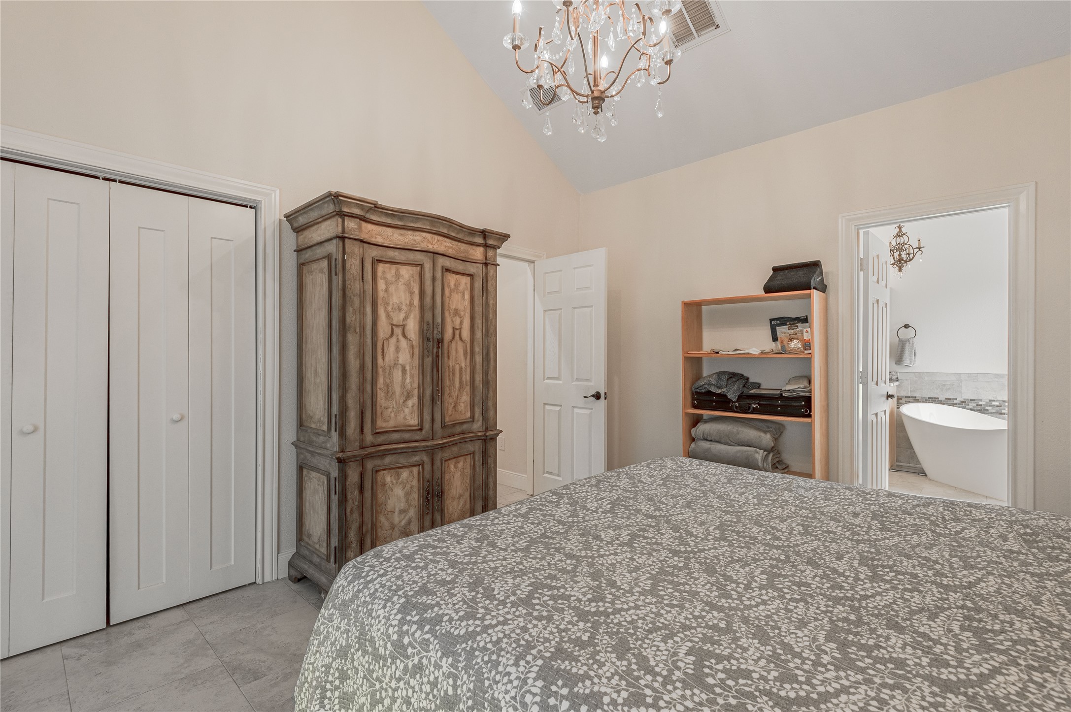 2803 Fm 2158 Midway, TX 75852 - Photo 18 of 49 a spacious bedroom with a bed and a chandelier