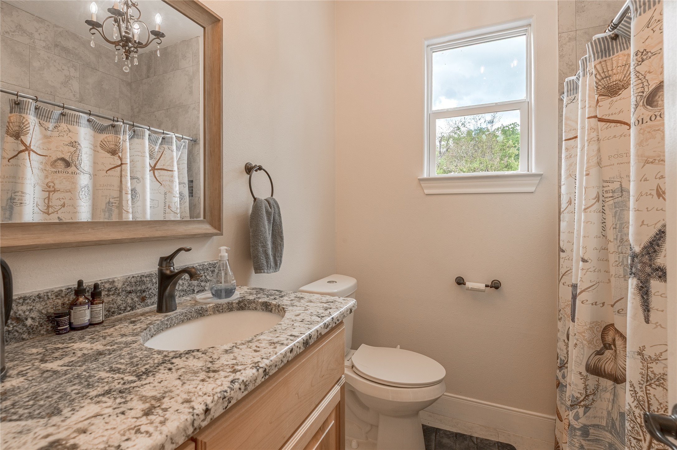 2803 Fm 2158 Midway, TX 75852 - Photo 26 of 49 a bathroom with a granite countertop sink toilet and shower