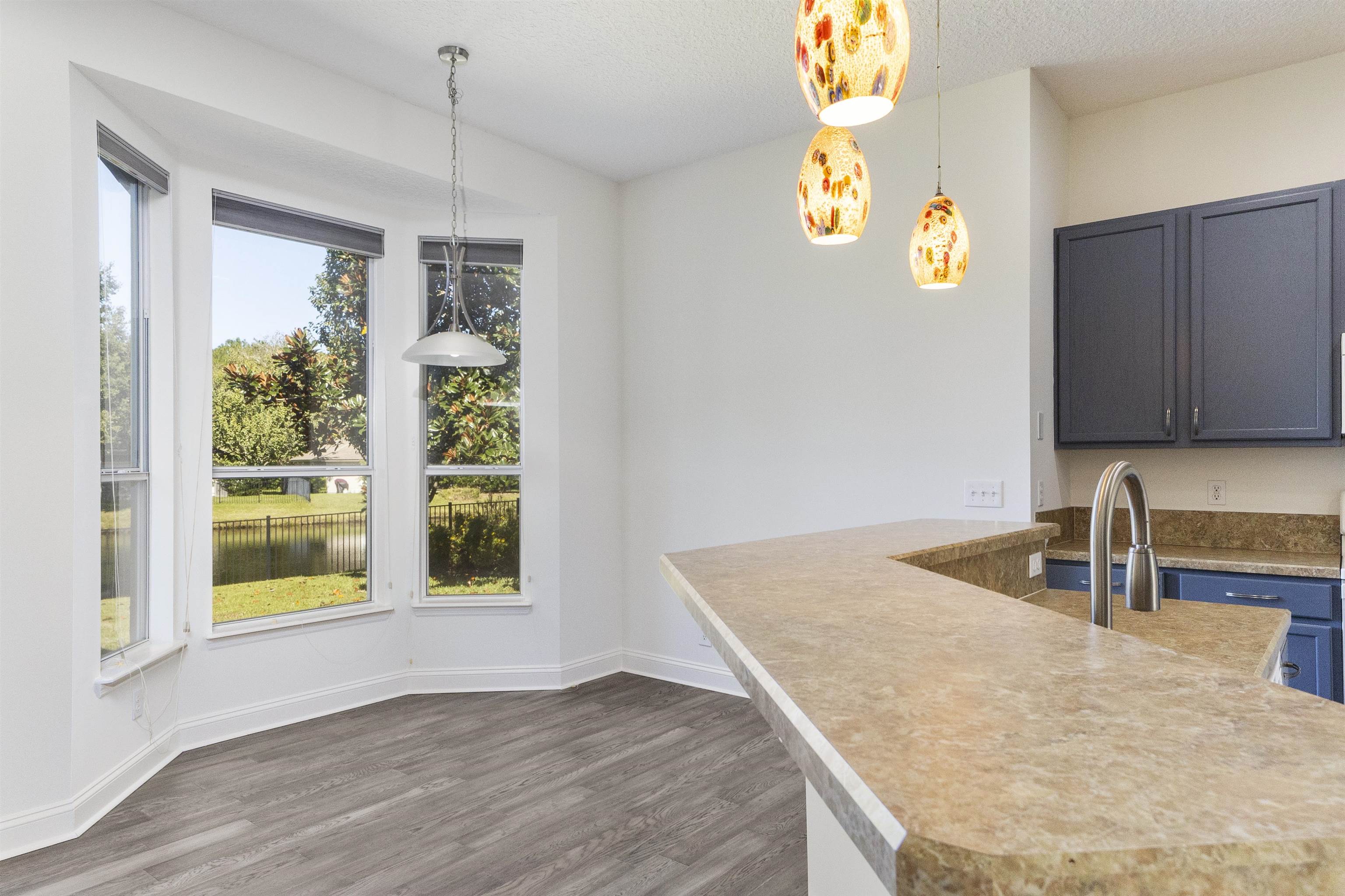 145 Whisper Ridge Drive St. Augustine, FL 32092 - Photo 22 of 43 a kitchen with a sink a counter top space and a window