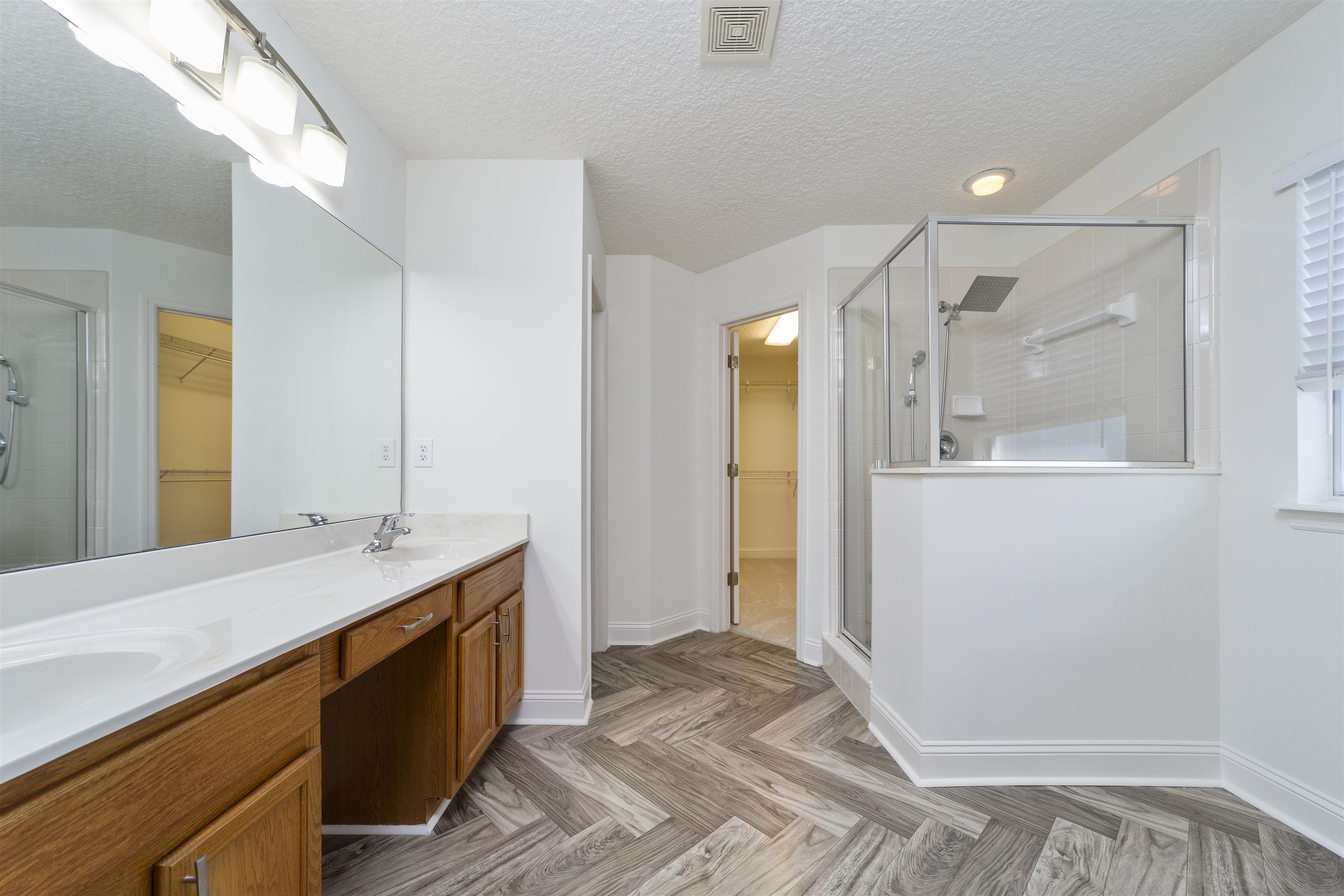 145 Whisper Ridge Drive St. Augustine, FL 32092 - Photo 28 of 43 a bathroom with a sink and a mirror