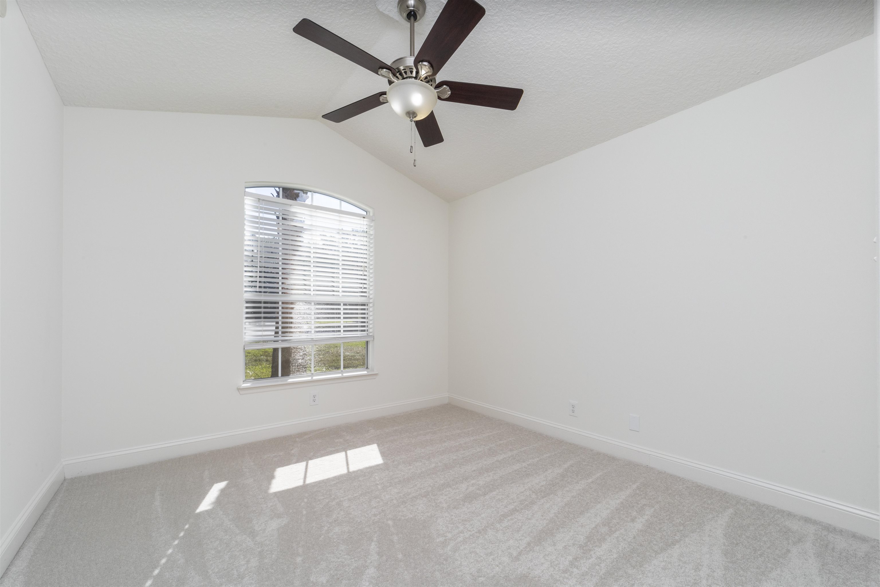 145 Whisper Ridge Drive St. Augustine, FL 32092 - Photo 33 of 43 an empty room with a window and a fan