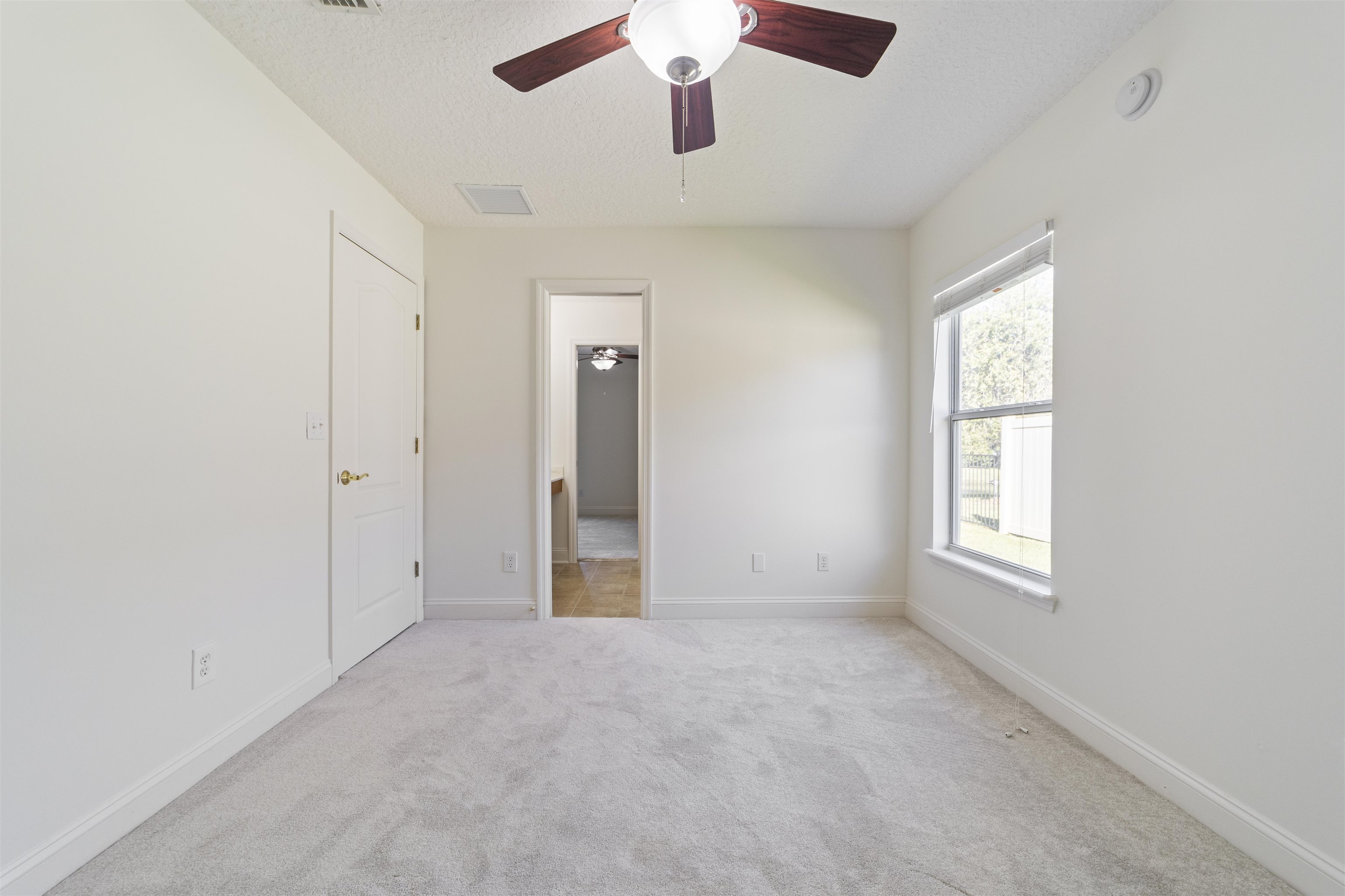145 Whisper Ridge Drive St. Augustine, FL 32092 - Photo 36 of 43 a view of an empty room with a window