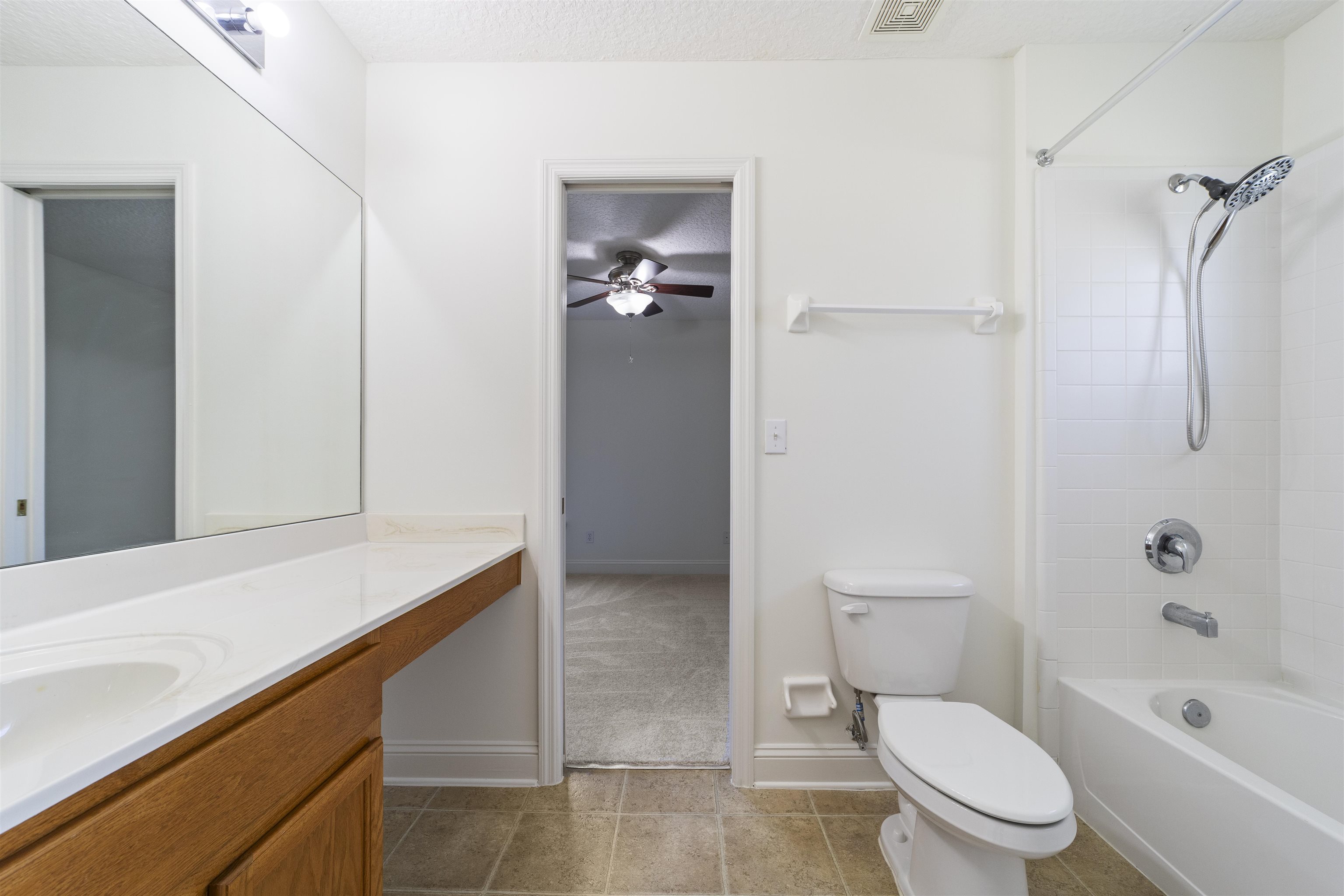 145 Whisper Ridge Drive St. Augustine, FL 32092 - Photo 37 of 43 a bathroom with a sink a toilet and shower