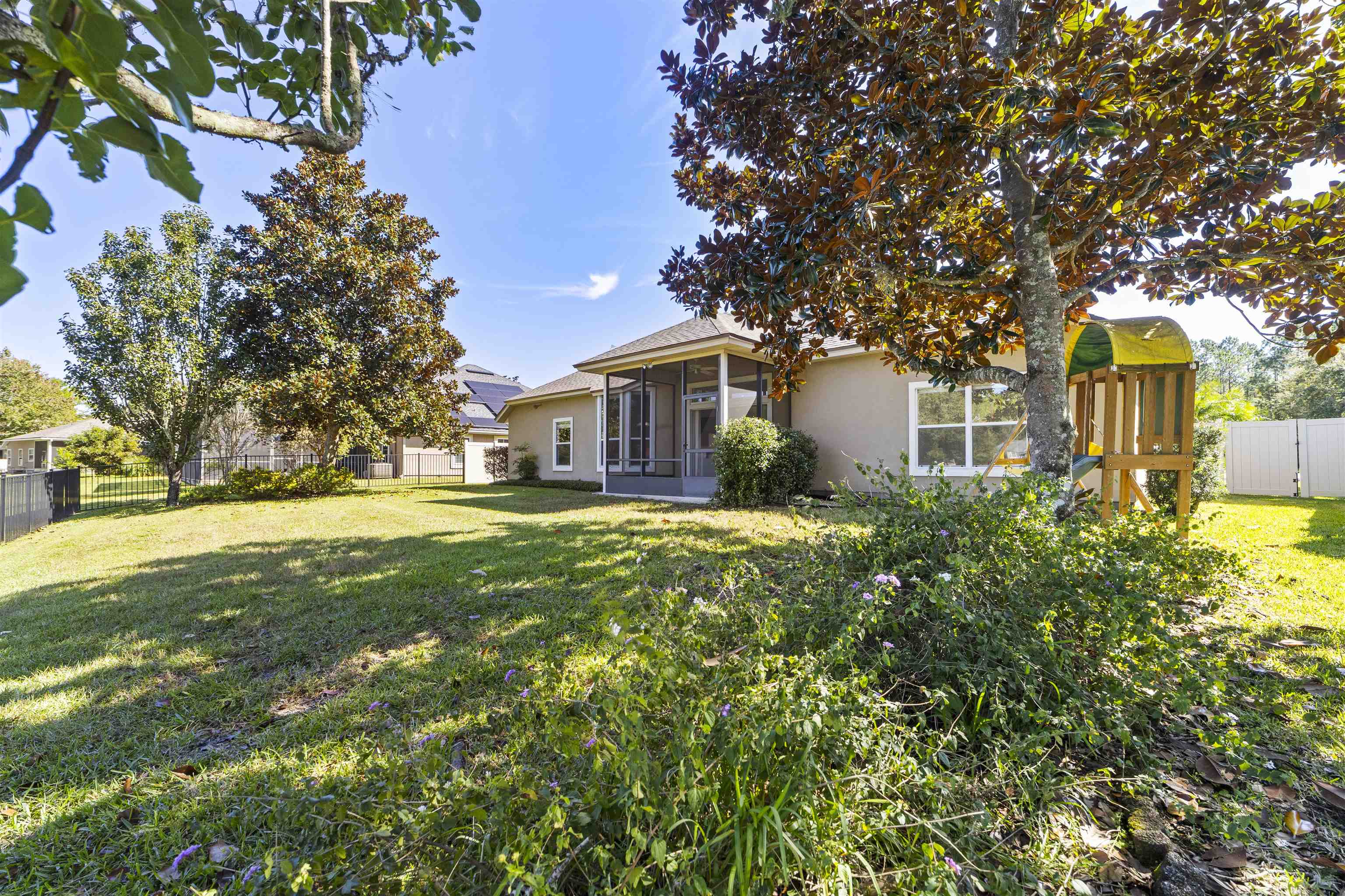 145 Whisper Ridge Drive St. Augustine, FL 32092 - Photo 9 of 43 a front view of house with yard and green space