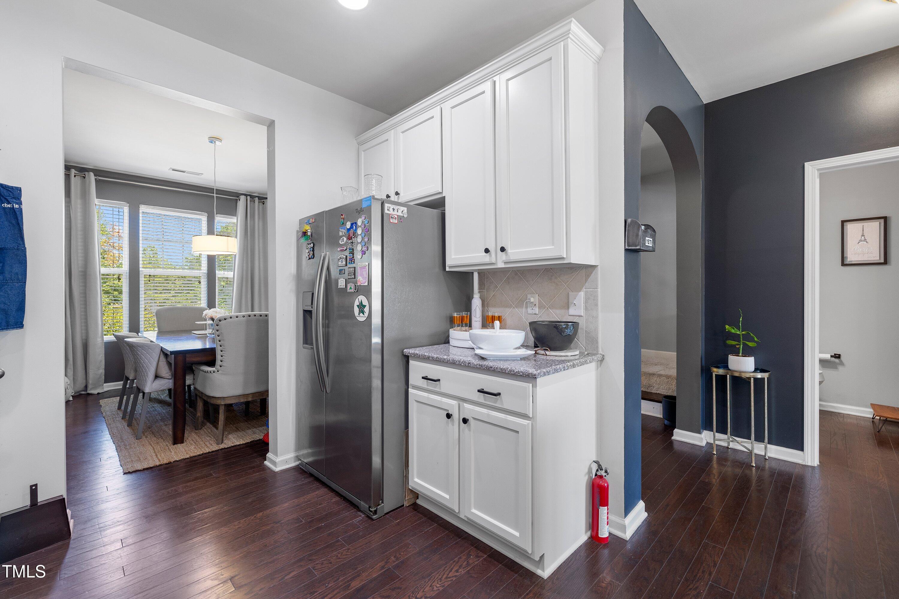 9352 Wooden Road Raleigh, NC 27617 - Photo 19 of 43 a kitchen with a refrigerator and a stove top oven