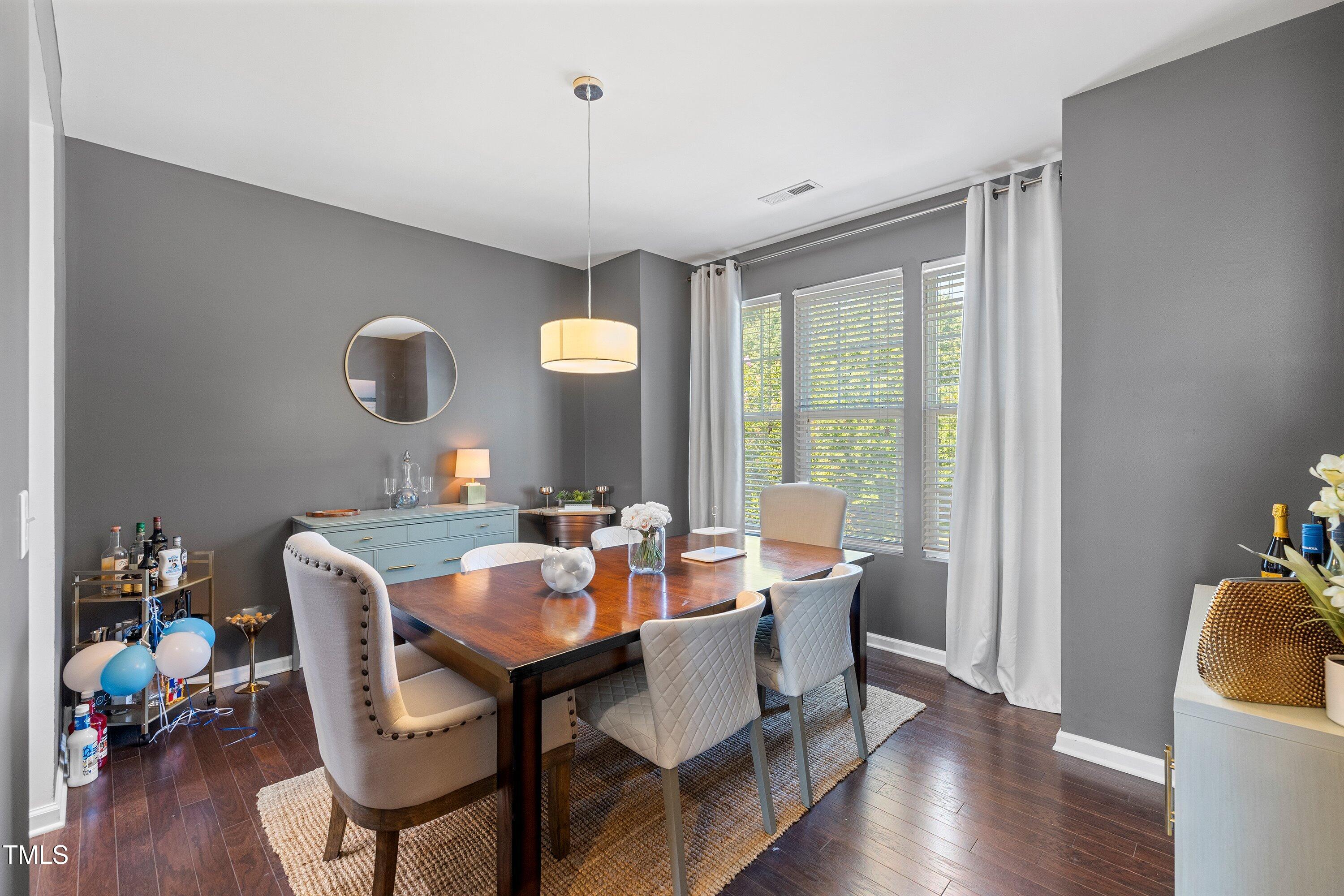 9352 Wooden Road Raleigh, NC 27617 - Photo 20 of 43 a view of a dining room with furniture window and wooden floor