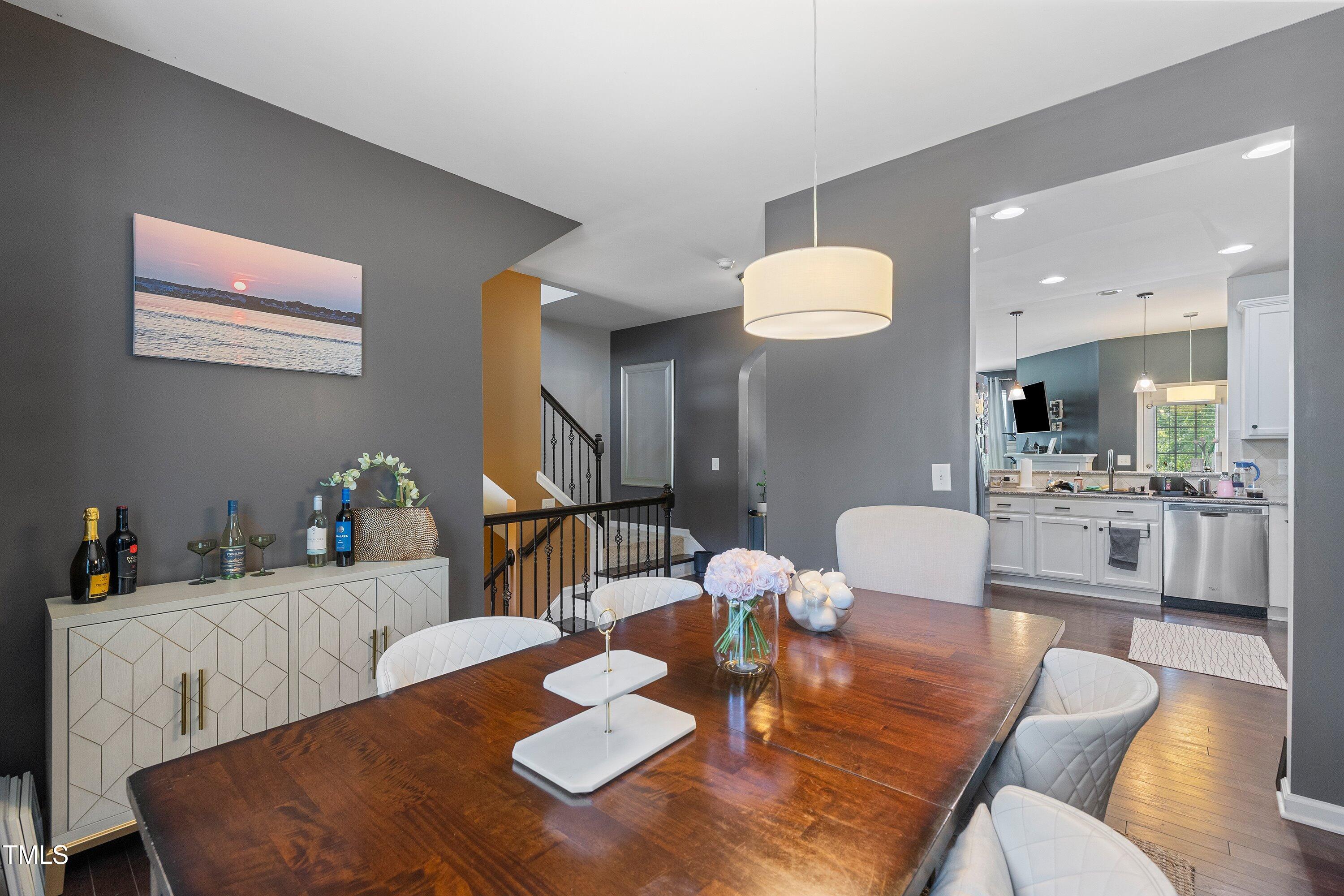 9352 Wooden Road Raleigh, NC 27617 - Photo 21 of 43 a view of a dining room with furniture and wooden floor