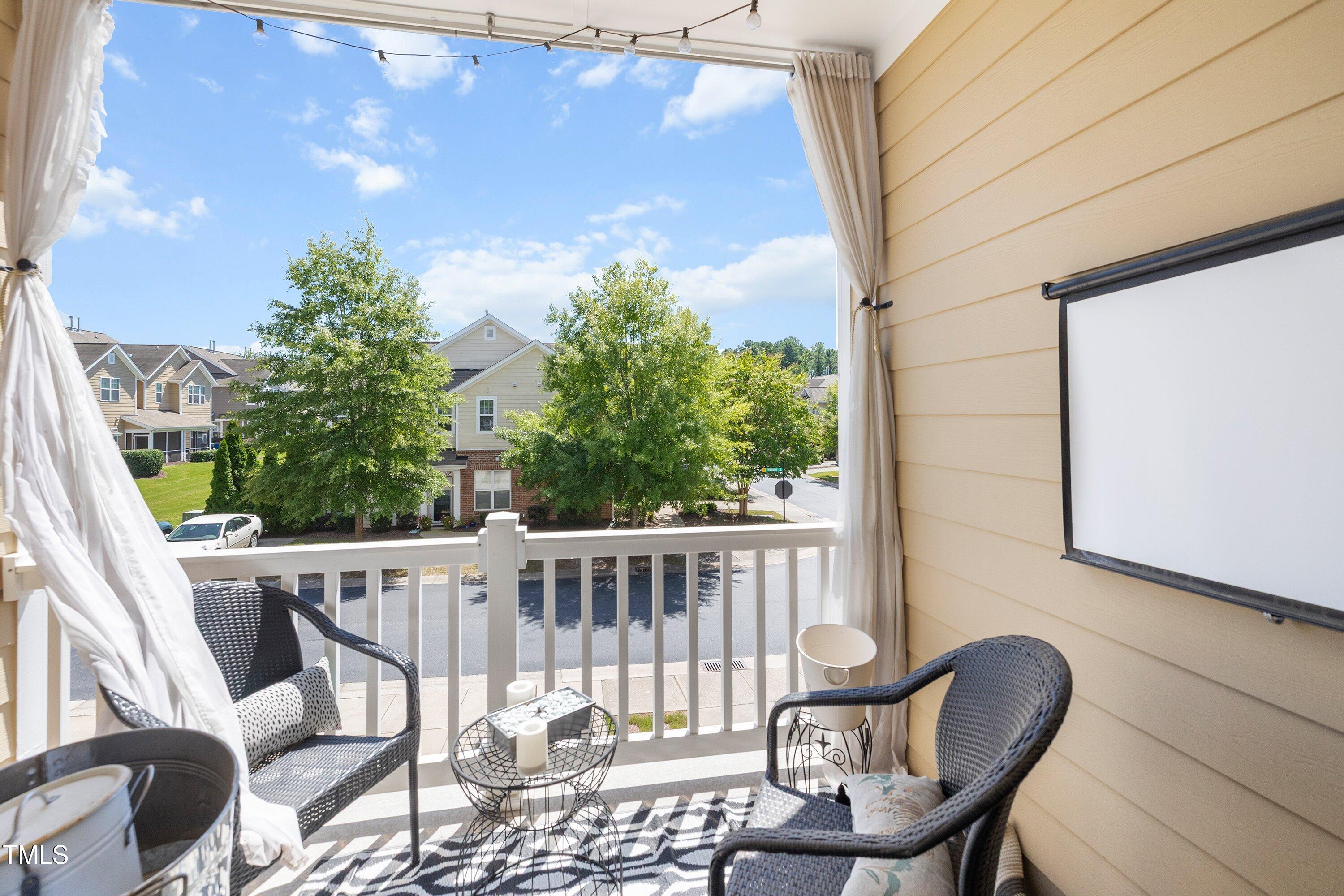 9352 Wooden Road Raleigh, NC 27617 - Photo 22 of 43 a view of a chair and table in the balcony