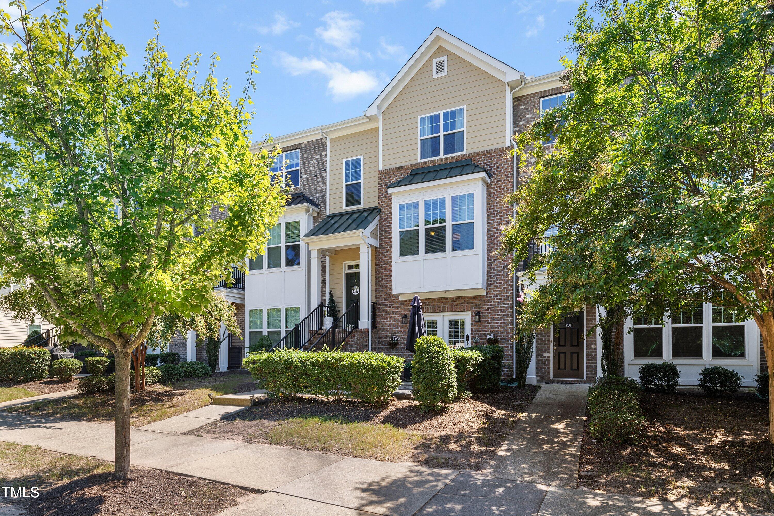 9352 Wooden Road Raleigh, NC 27617 - Photo 2 of 43 a front view of a house with a yard