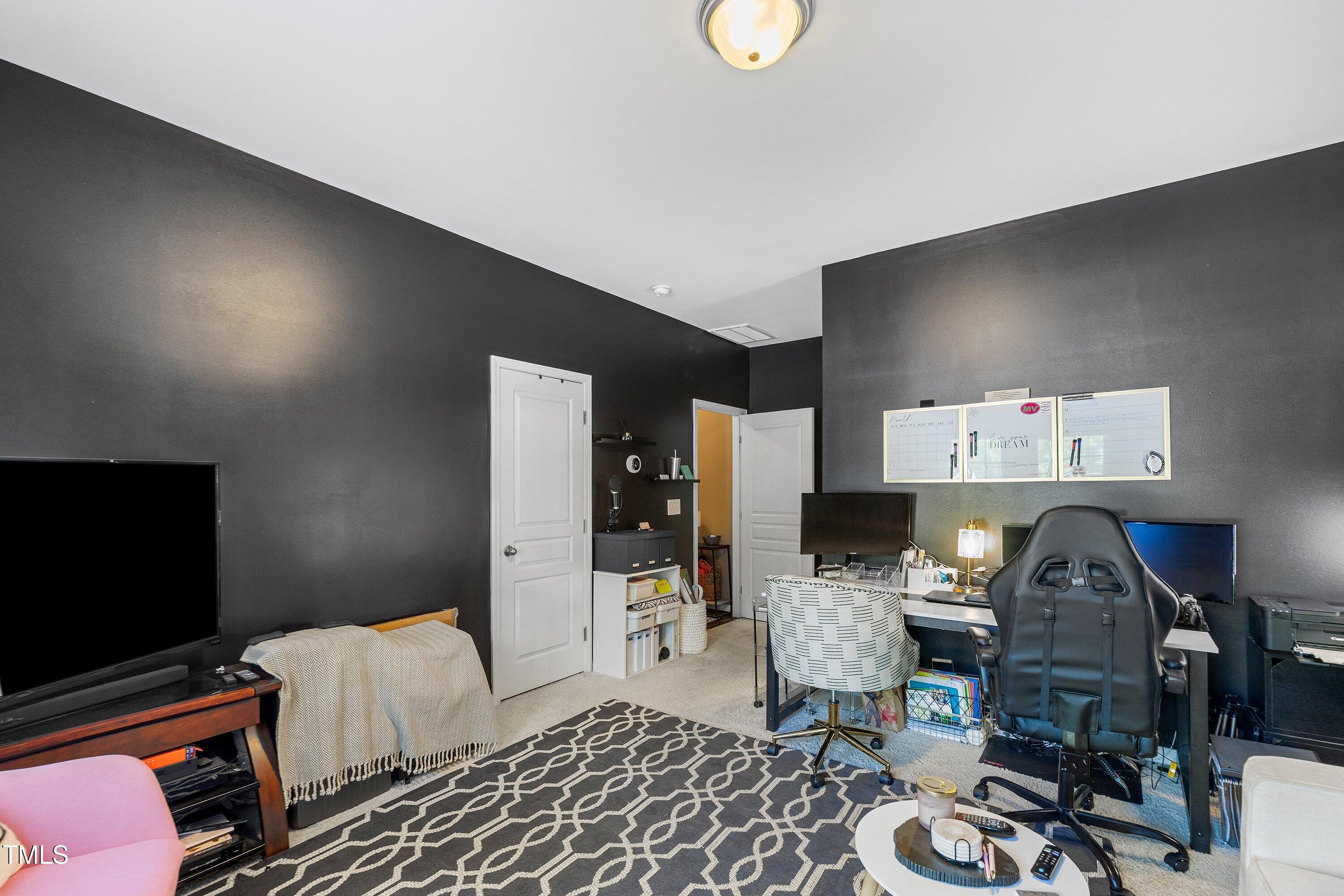 9352 Wooden Road Raleigh, NC 27617 - Photo 32 of 43 a workspace with furniture and wooden floor