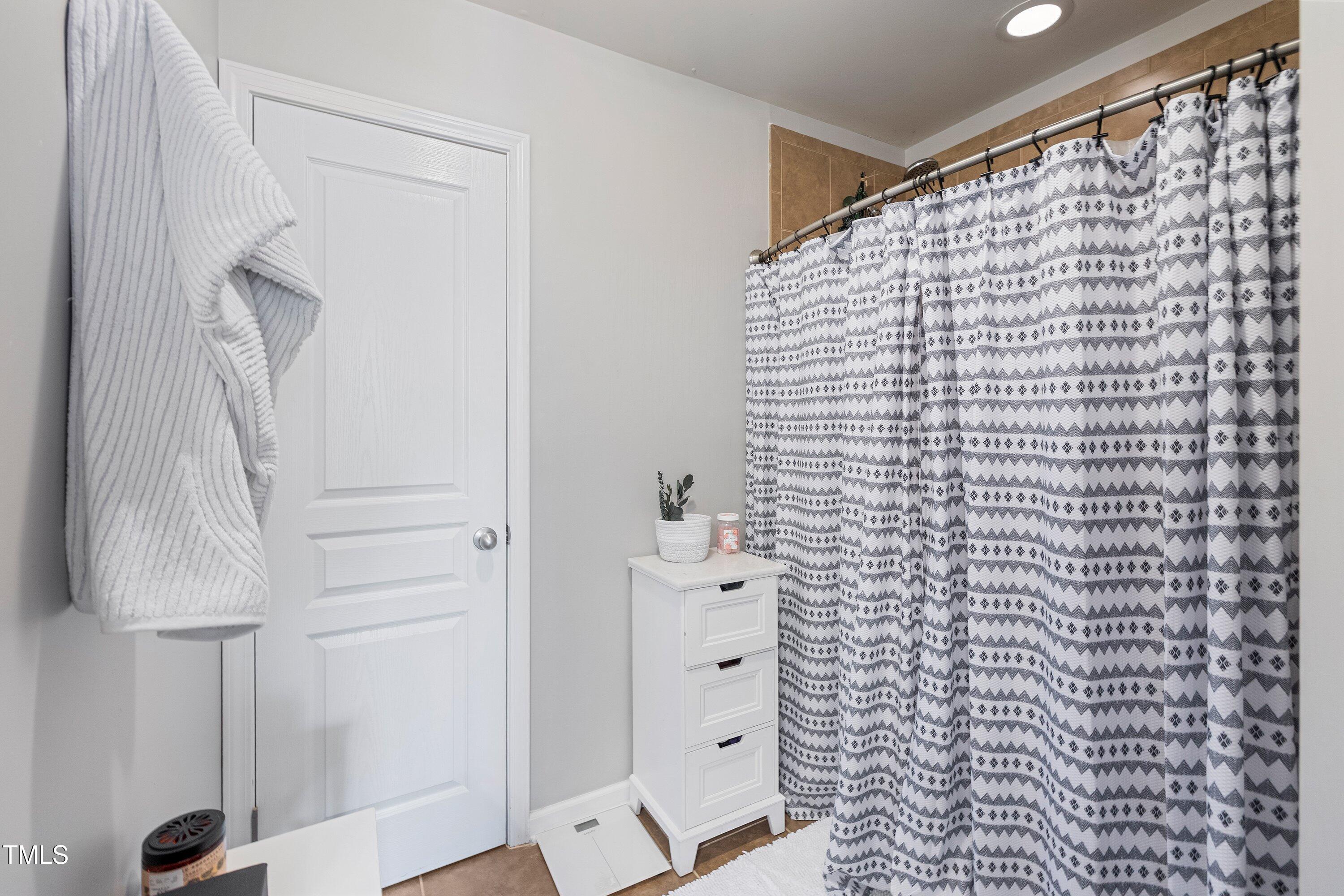 9352 Wooden Road Raleigh, NC 27617 - Photo 36 of 43 a bathroom with a shower