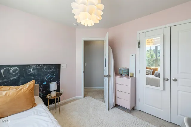 wooden floor with a chandelier in a room