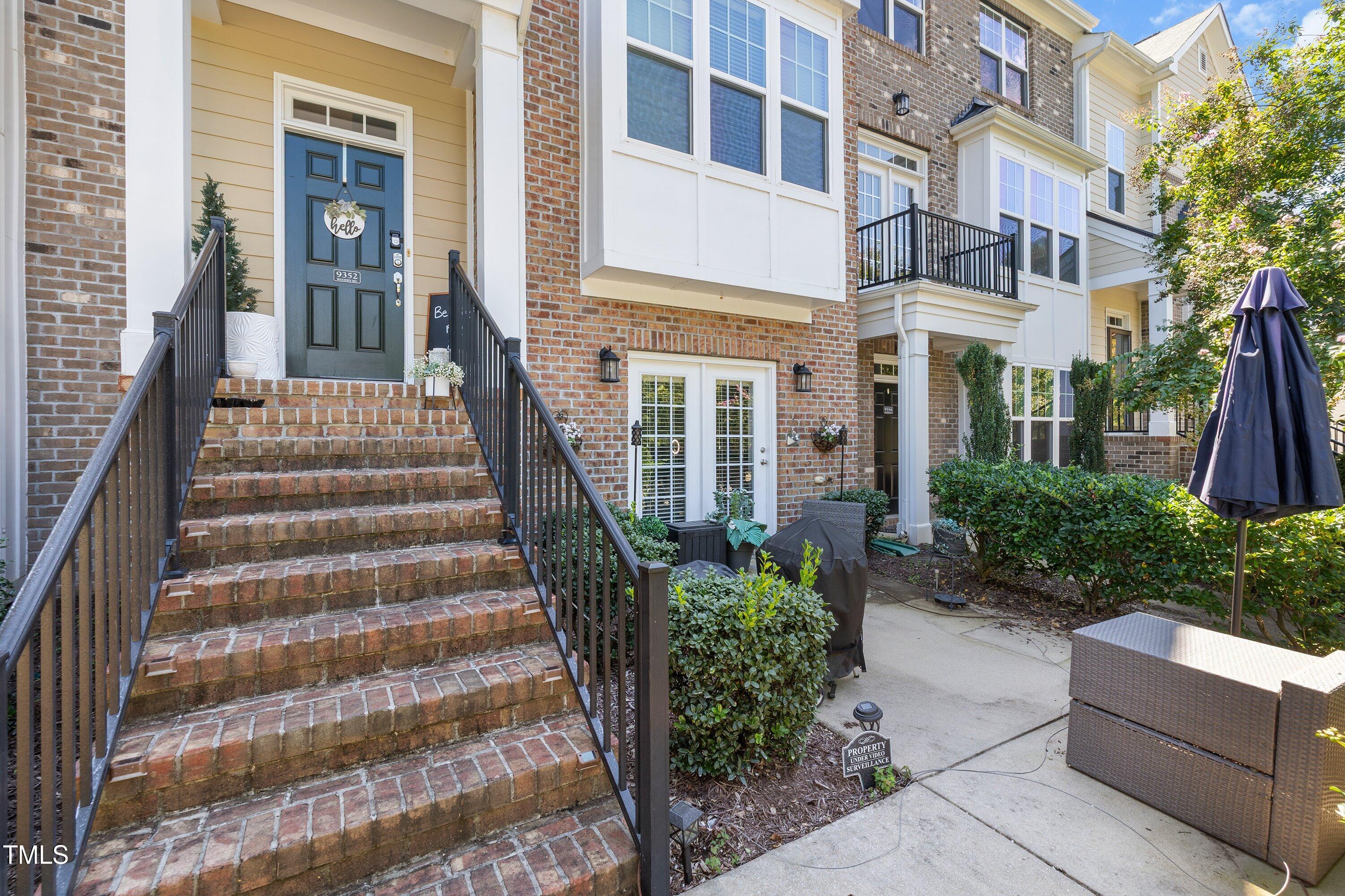 9352 Wooden Road Raleigh, NC 27617 - Photo 4 of 43 a view of a building with a garden