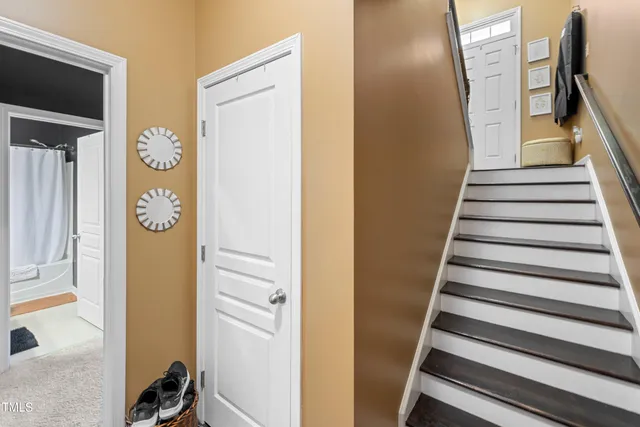 a view of an entryway with wooden floor