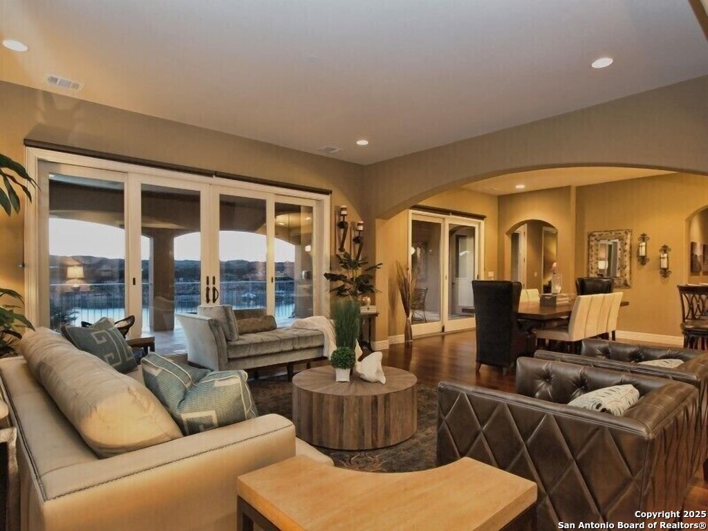 21913 Mockingbird Street Lago Vista, TX 78645 - Photo 12 of 39 a living room with furniture and a large window