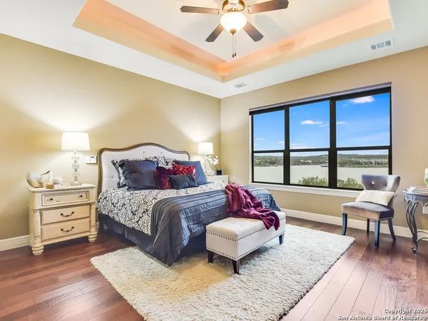 a bedroom with a large bed and a large window