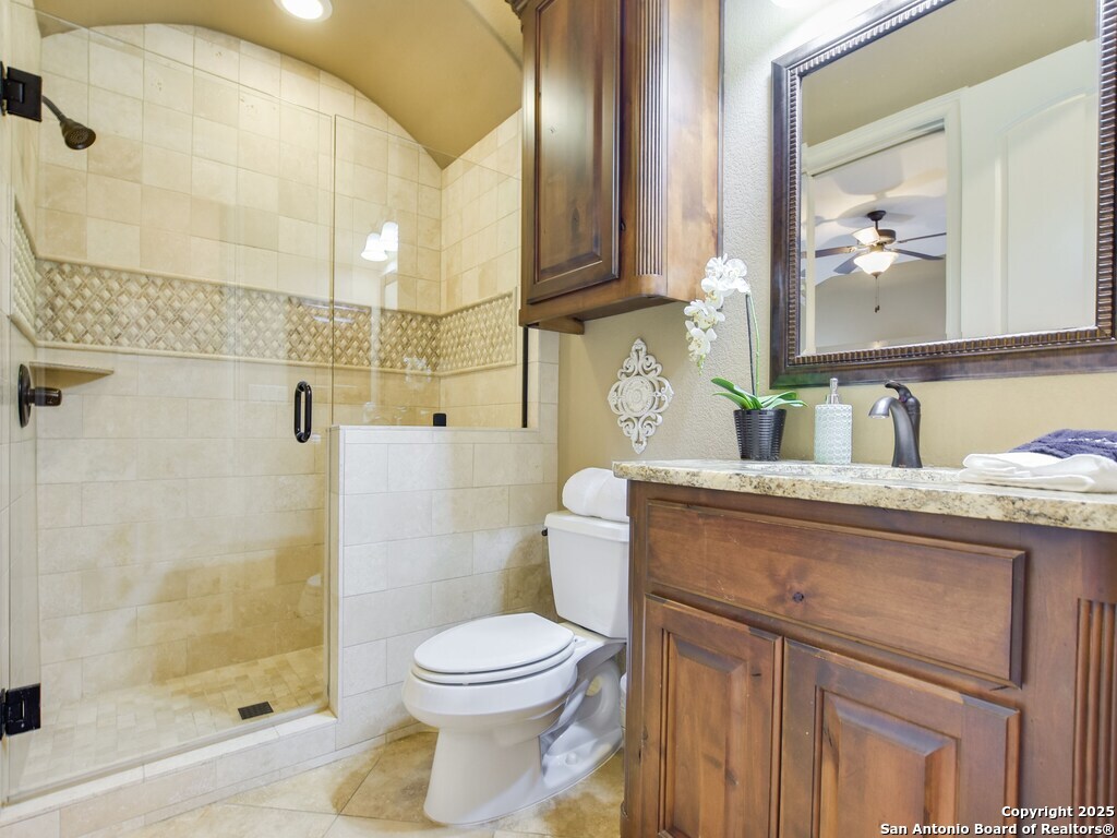 21913 Mockingbird Street Lago Vista, TX 78645 - Photo 19 of 39 a bathroom with a sink a toilet and shower